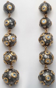 A long necklace with gold and silver beads