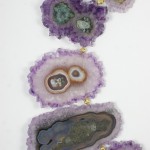 A close up of some purple and green geodes