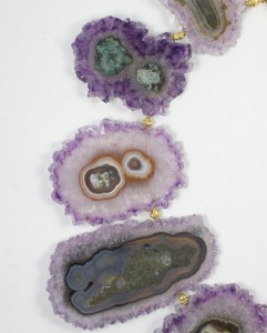 A close up of some purple and green geodes