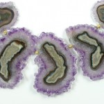 A close up of the purple and green agate slices.