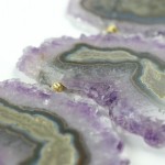 A close up of the purple and gold geode