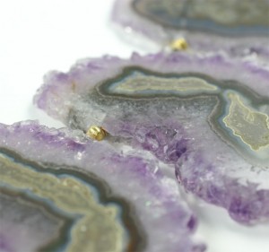 A close up of the purple and gold geode
