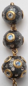 A close up of the bottom part of a necklace