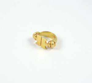 A gold ring with two small squares on it.