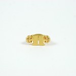 A gold ring with two circles on it.