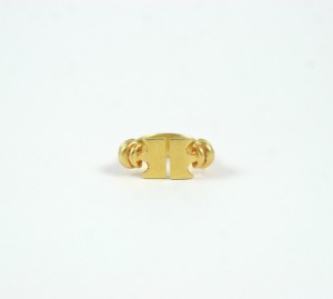 A gold ring with two circles on it.