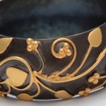 A close up of the gold and black design on this bowl