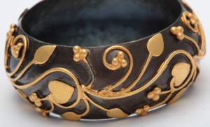 A close up of the gold and black design on this bowl