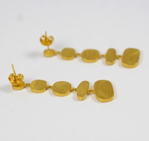 A pair of gold earrings with different shapes.