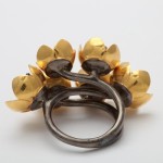 A ring with gold flowers on it.