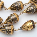 A close up of the gold and black beads