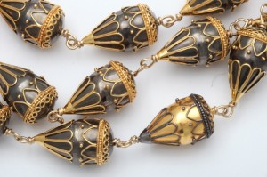 A close up of the gold and black beads