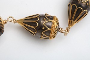 A close up of the gold and black bead