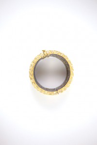 A gold ring with a white background