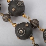 A close up of the beads on a necklace