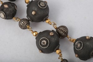 A close up of the beads on a necklace
