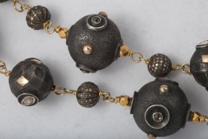 A close up of the beads on a necklace