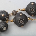 A close up of the beads on a necklace