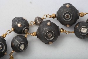 A close up of the beads on a necklace