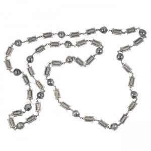 A long silver chain with metal beads and a large bead.