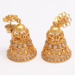 A pair of gold and diamond earrings.