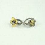 Two rings with a flower design on them.