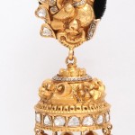 A gold and diamond elephant head bell.