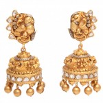 A pair of gold and diamond earrings with two large, ornate bells.