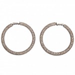 A pair of large diamond hoop earrings.