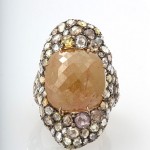 A ring with a large stone and small stones.