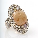 A ring with a large stone and small stones.