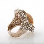 A gold ring with some kind of stone on it