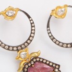 A pair of earrings with diamonds and rubies.