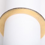 A close up of the bottom of a wooden arch