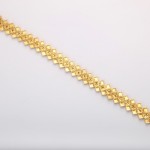A gold chain is shown on the white background.