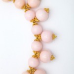 A close up of the necklace on a white surface