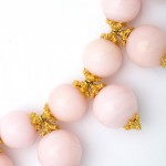 A close up of the beads on a necklace