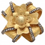 A gold and diamond flower ring